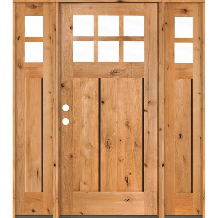 a wooden door with two side panels