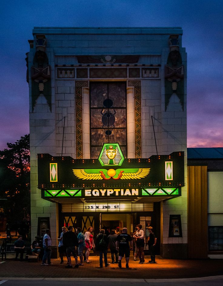 the egyptian theater is lit up at night