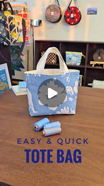 a tote bag sitting on top of a wooden table