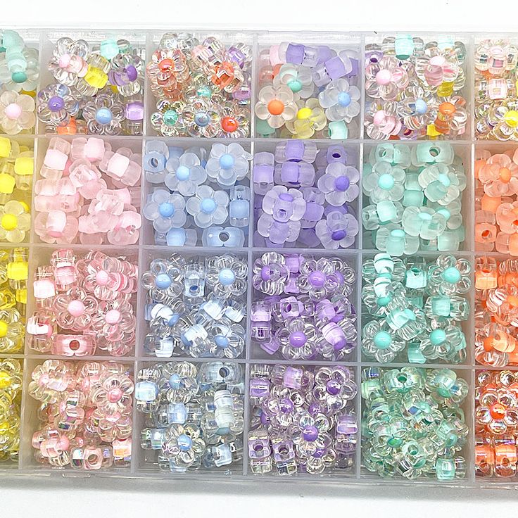 a box filled with lots of different colored beads