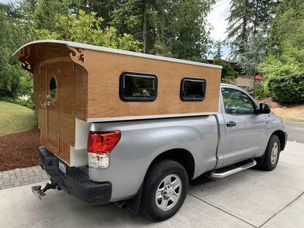 a truck with a camper attached to the back