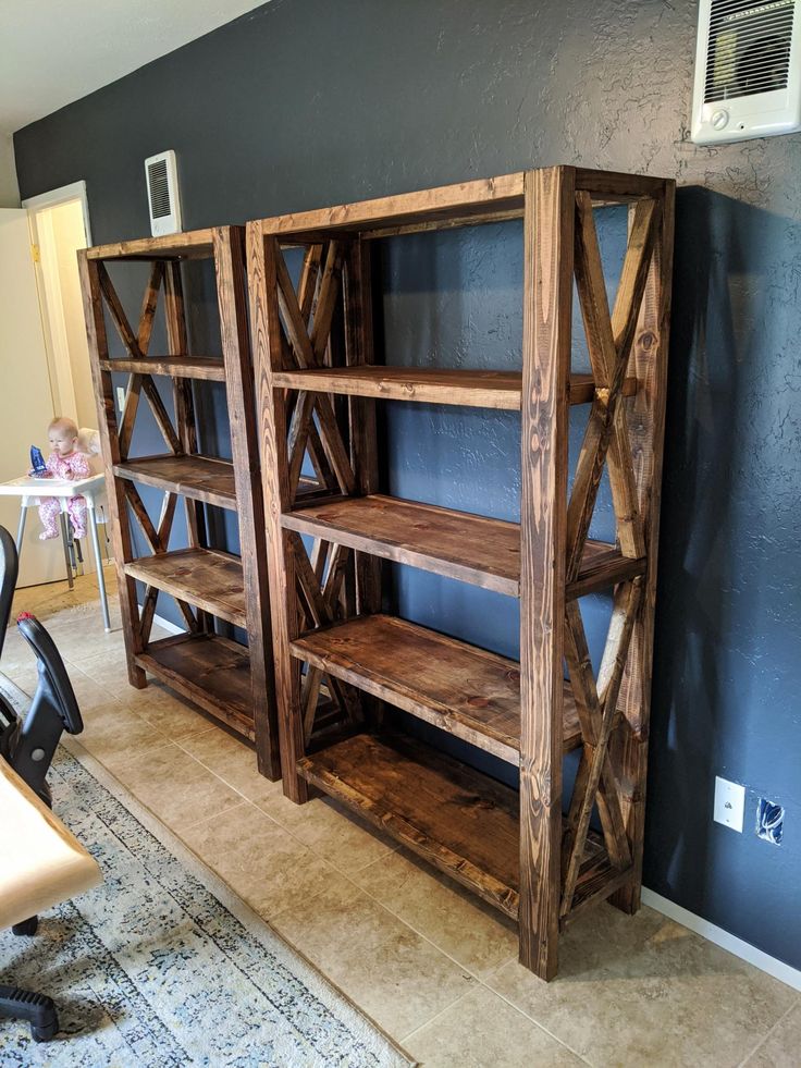 two wooden shelves sitting next to each other