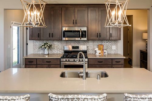 a kitchen with stainless steel appliances and wooden cabinets