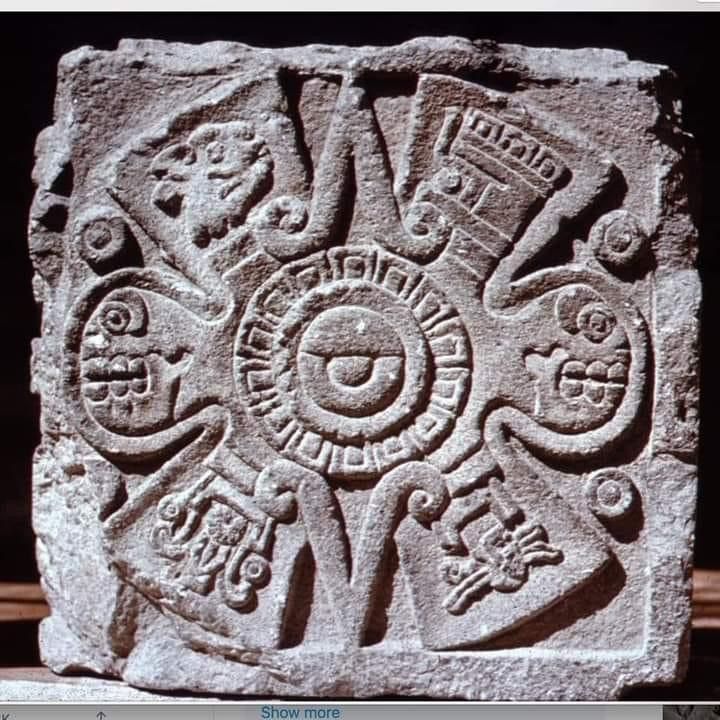 a stone block with carvings on it