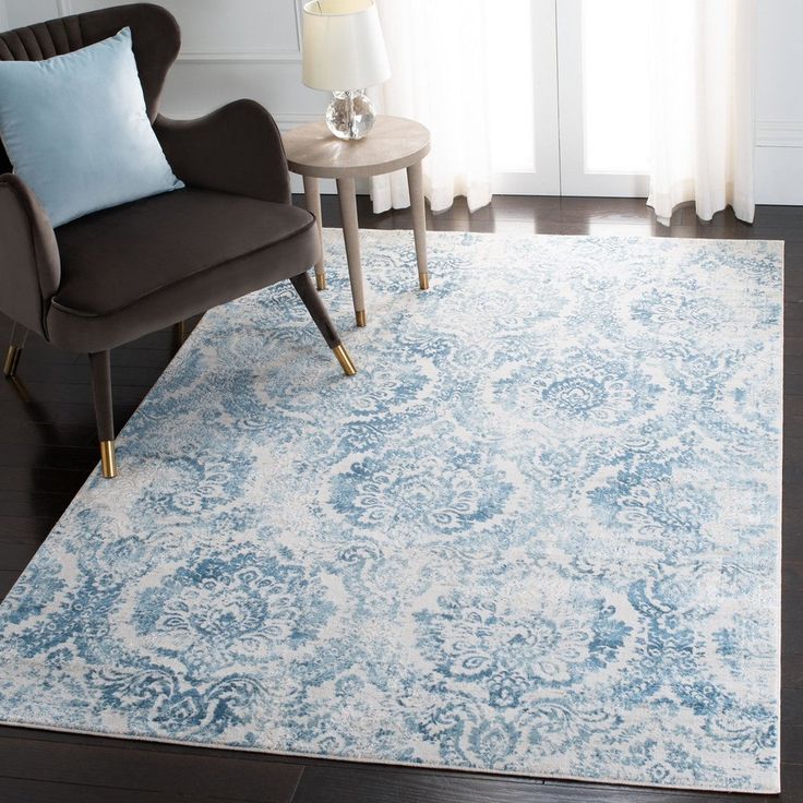 a blue and white rug in a living room