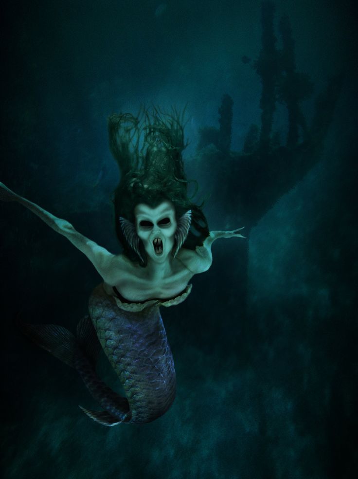 a skeleton mermaid is swimming in the water