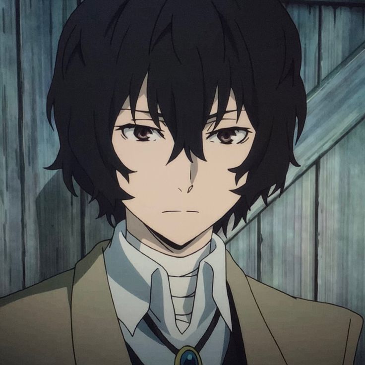 an anime character wearing a suit and tie with his eyes wide open, staring at the camera