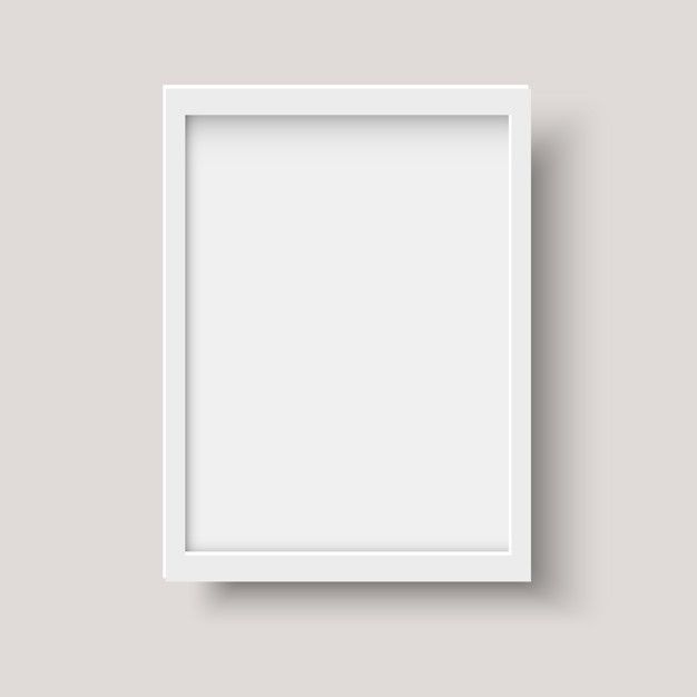 an empty white frame hanging on the wall