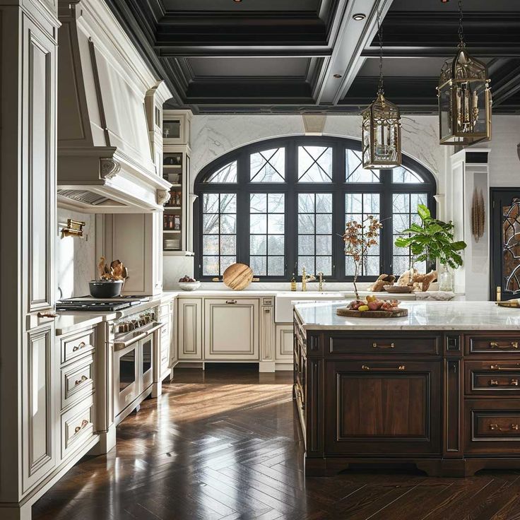 a large kitchen with an arched window and wooden flooring, along with white cabinets