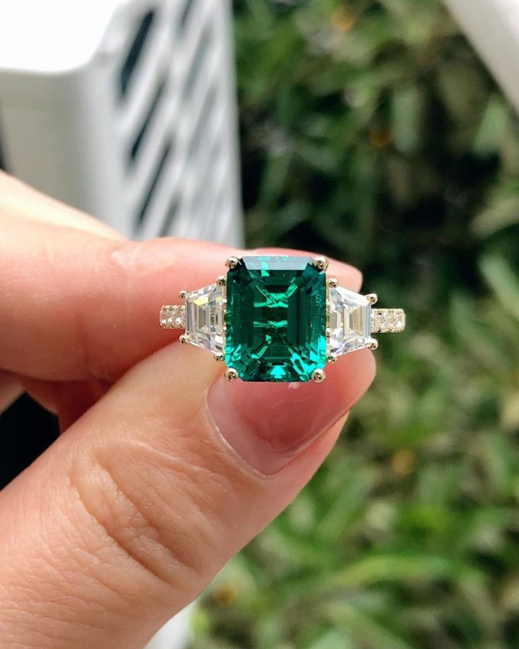 ------------------------------------------------------------------------------ ❤ Product Information ❤ ------------------------------------------------------------------------------ Brilliant 3.55CT Lab Created Emerald Center Engagement Ring,Minimalist Style Anniversary Ring,Promise Ring For Female,14K Yellow Gold Ring ✥ 𝐌𝐚𝐢𝐧 𝐒𝐭𝐨𝐧𝐞 𝐃𝐞𝐭𝐚𝐢𝐥𝐬 ↣ Shape:  Emerald Cut ↣ Type: Genstone ↣ Weight: 3.55 Carat (App.) ↣ Dimension: 8x11 MM (App.)  ↣ Color: Colorless ↣ Clarity: AAAA+ ↣ Making Process: Handmade - Crafted by our experienced team ✥ 𝐒𝐢𝐝𝐞 𝐒𝐭𝐨𝐧𝐞 𝐃𝐞𝐭𝐚𝐢𝐥𝐬 ↣ Shape: Trapezoid Shape ↣ Type: Moissanite ↣ Weight: 0.80 Carat (App.) ↣ Color/: Colorless/ VVS-VS ↣ Options: Lab Grown Diamond and Natural Diamond (Possible on request while placing an order and Extra Chargeabl Emerald Ring Wedding, Emerald Cut Emerald Ring, Emerald Engagement Ring Green, Engagement Ring Minimalist, Art Deco Emerald, May Birthstone Rings, Emerald Wedding Rings, Raw Emerald, Green Emerald Ring