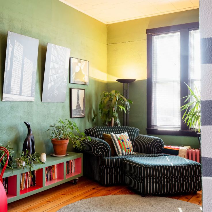 a living room filled with furniture and potted plants