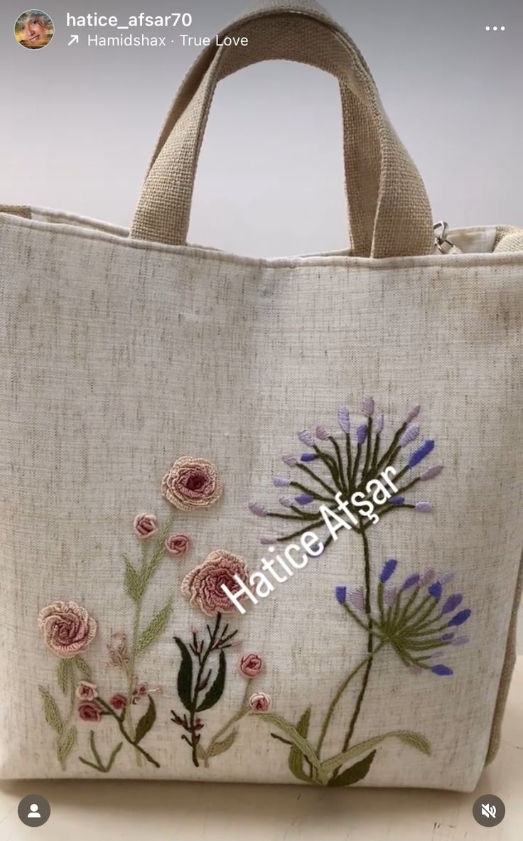 an embroidered bag with flowers on it