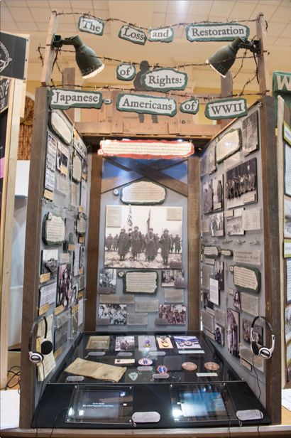 an exhibit case with pictures and information on it