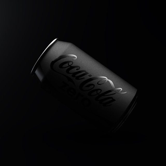 a black and white photo of a can of corona beer in the dark with its lid open