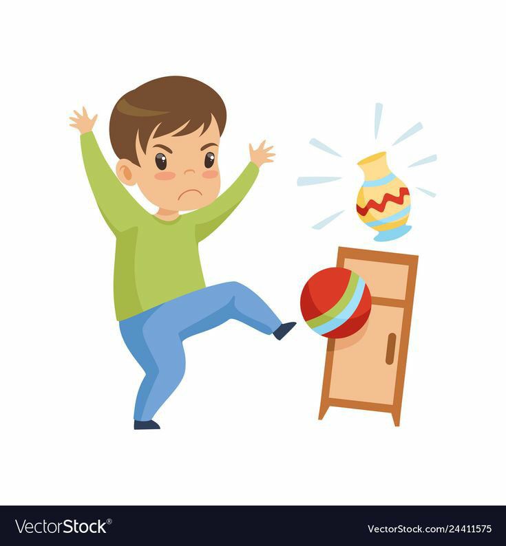 a boy is trying to throw a ball into the cabinet with his arms and legs