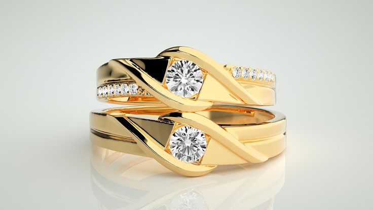 two gold wedding rings with diamonds on them