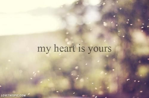 the words my heart is yours are displayed on a blurry photo with trees in the background