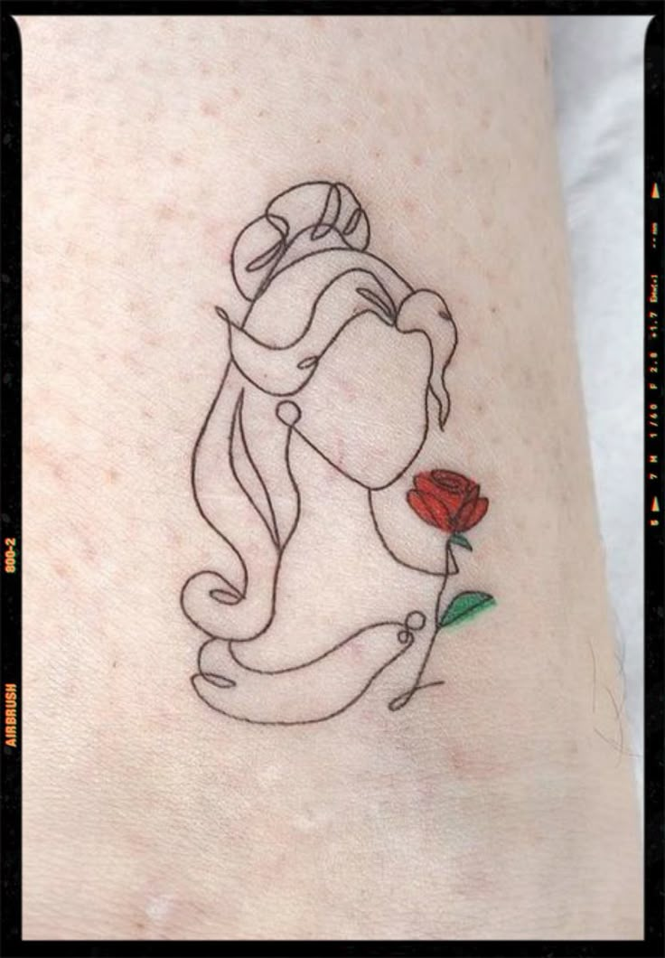 a woman's tattoo with a rose on her left side arm and the outline of a girl holding a flower