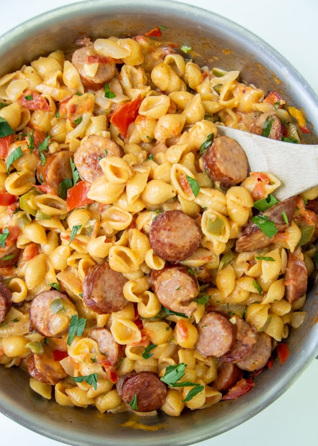 a pan filled with pasta and sausage