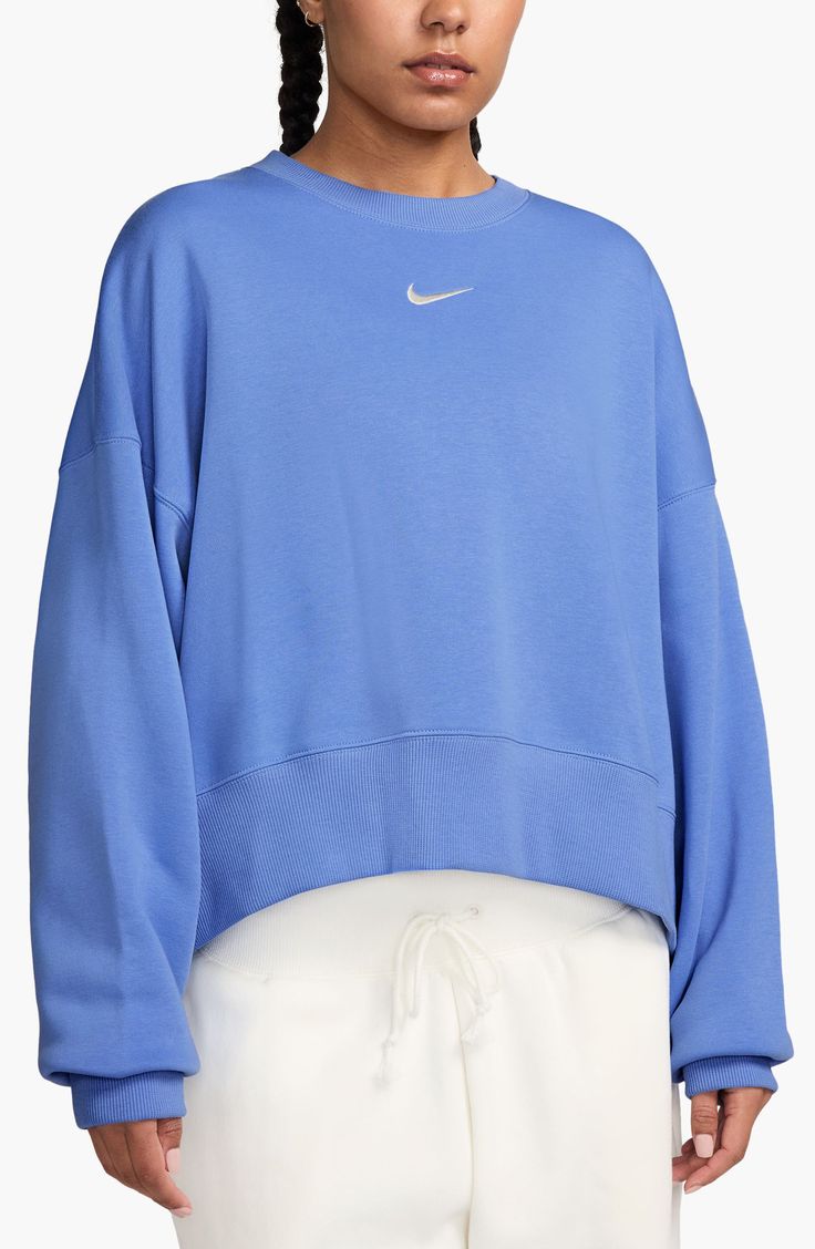 An embroidered Swoosh adds minimal branding to this cozy fleece sweatshirt cut for a relaxed, oversized fit that's enhanced by the dropped shoulders. 22" length (size Medium) Crewneck 80% cotton, 20% polyester Machine wash, tumble dry Imported Nike Phoenix Fleece, Nike Crew Neck, Minimal Branding, Blue Crewneck, Cut Sweatshirts, Nike Sweatshirts, Tech Fleece, Blue Sweatshirt, Black Long Sleeve Dress