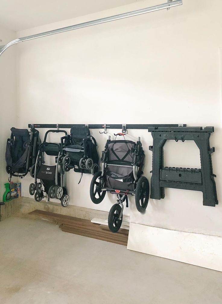 several wheelchairs are hanging on the wall