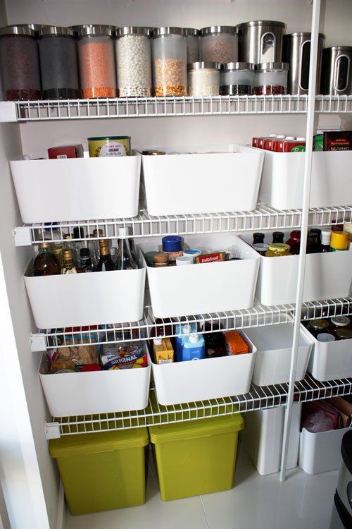 an organized pantry with bins and containers