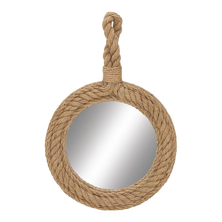 a round mirror hanging on a rope