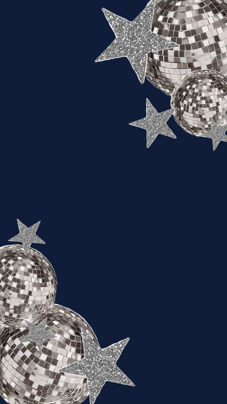 three shiny disco balls and stars on a dark blue background