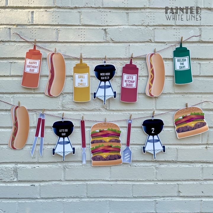 hot dogs, hamburgers and ketchup hanging from clothes pins on a brick wall