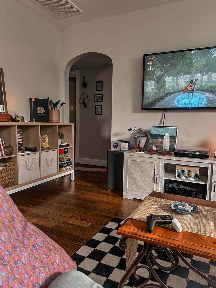 a living room filled with furniture and a flat screen tv