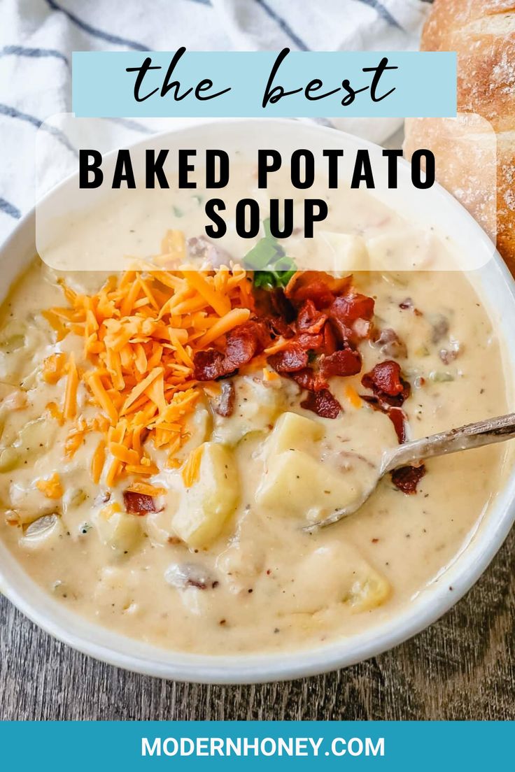 a bowl of baked potato soup with bread on the side