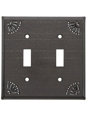 an outlet cover with two lights on each side and one light switch plate in the middle