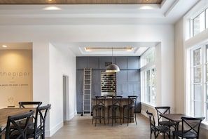 an empty dining room with tables and chairs