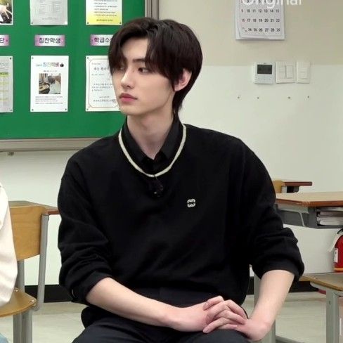 two young men sitting next to each other