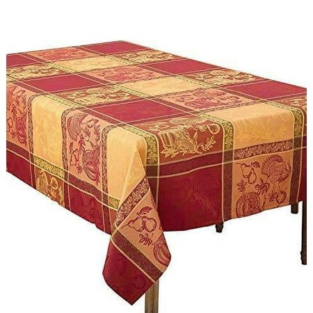 a red and yellow table cloth with an intricate design on the top, sitting on a metal stand