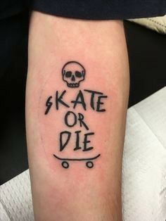 a skateboarder with a skull tattoo on his leg that says skate or die