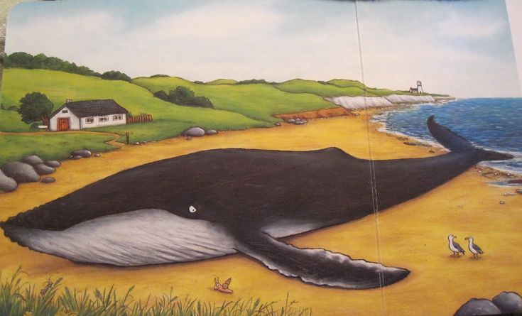 a painting of a whale laying on the beach