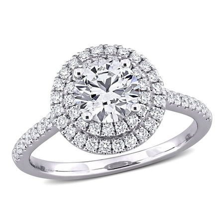 a white gold engagement ring with round diamonds