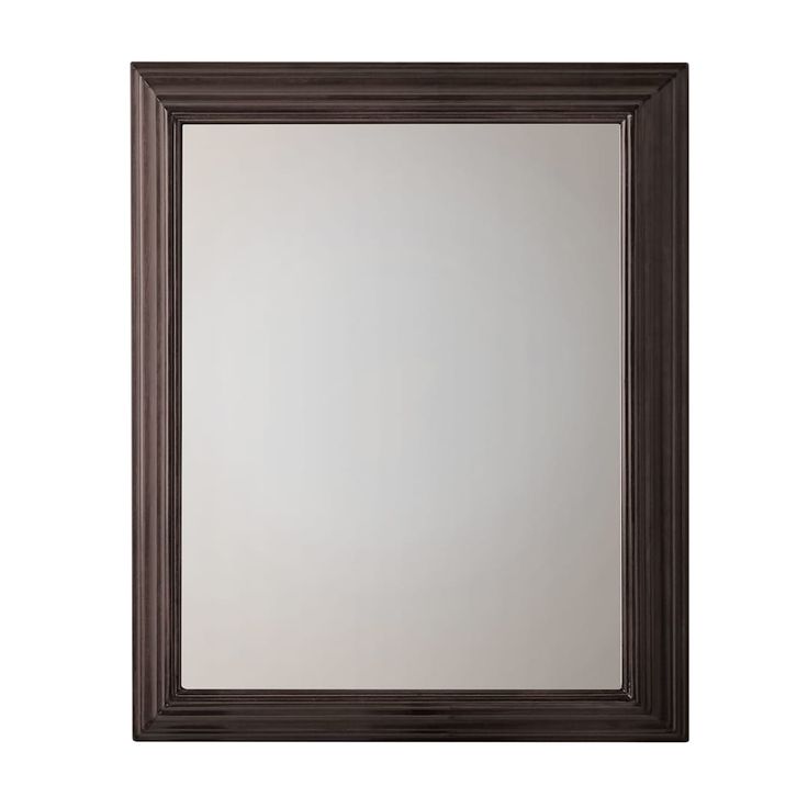 a brown framed mirror on a white wall