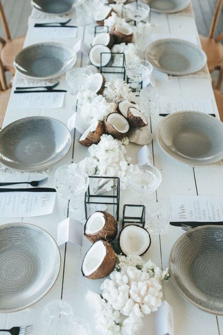 a long table with plates and bowls on it