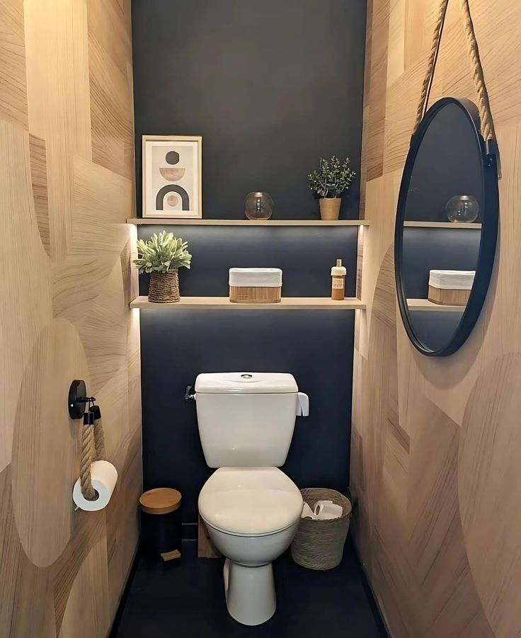 a small bathroom with wood paneled walls and black flooring, along with a white toilet