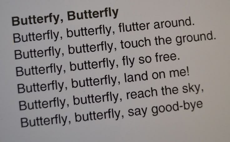 the text is written in black and white on a piece of paper that says butterfly, butterfly, butterfly