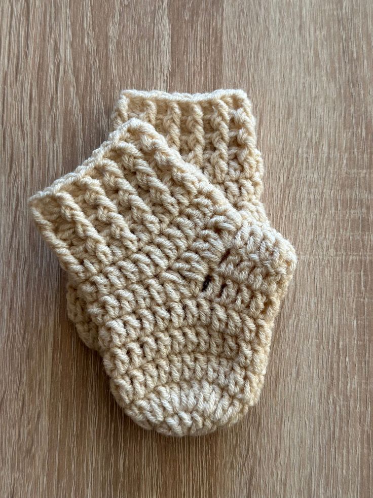 a crocheted dishcloth on a wooden surface