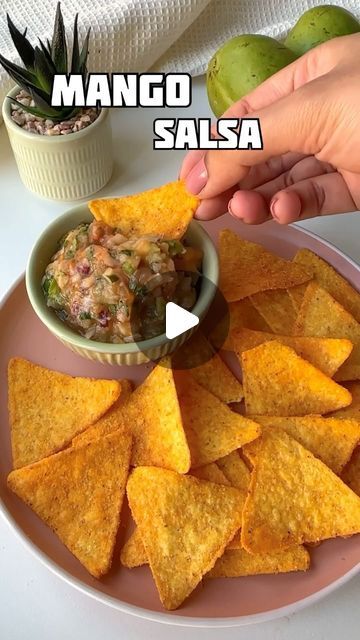 a plate with chips and guacamole on it