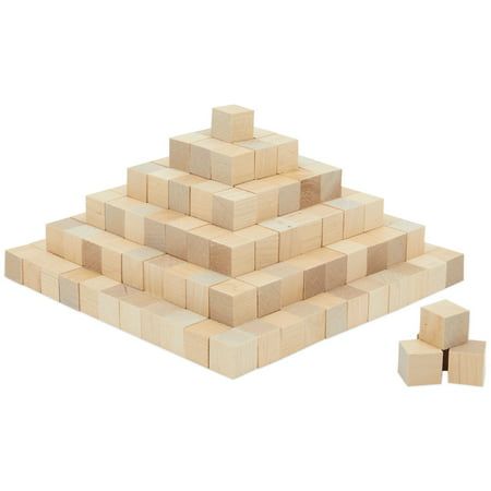 several wooden blocks stacked on top of each other in the shape of a pyramid, with one block missing