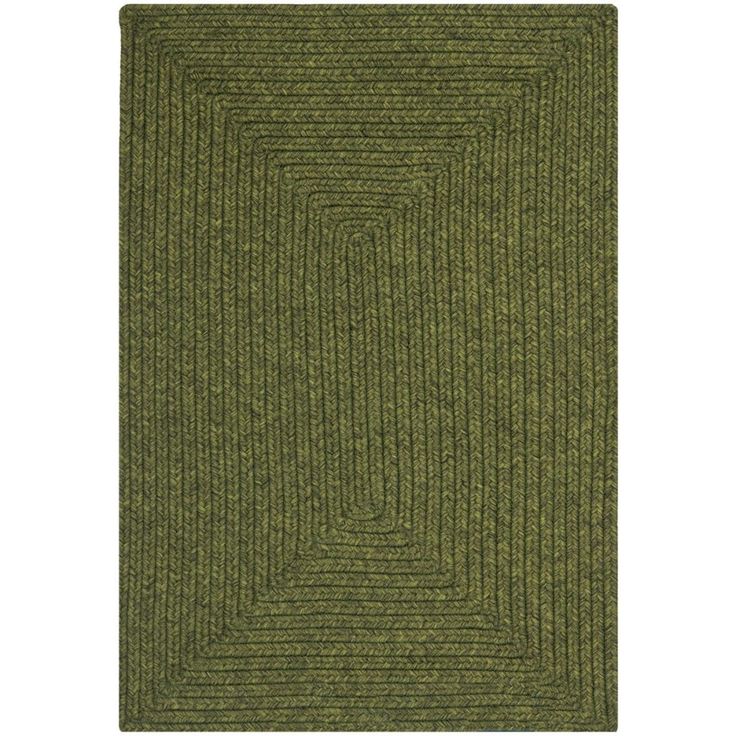 a green rug with an interlocked design