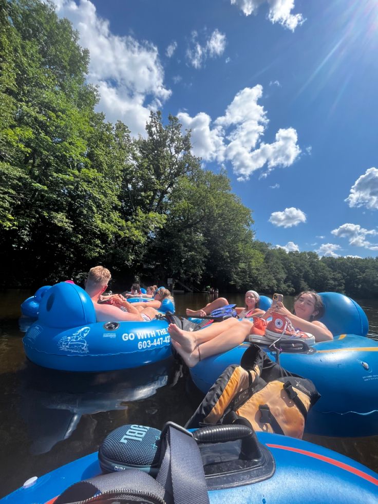 some people are floating down a river on rafts