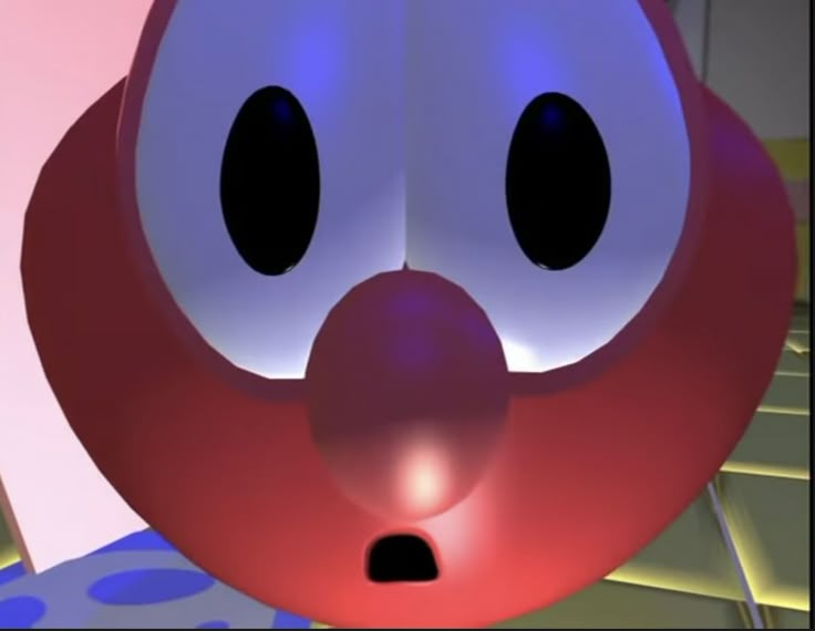 a close up of a cartoon character's face with big eyes and large nose