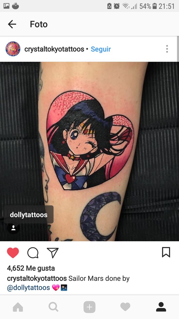 a woman's arm with an anime tattoo on it