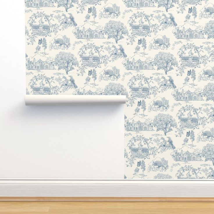 a wallpaper with blue toilers and trees on it in an empty room